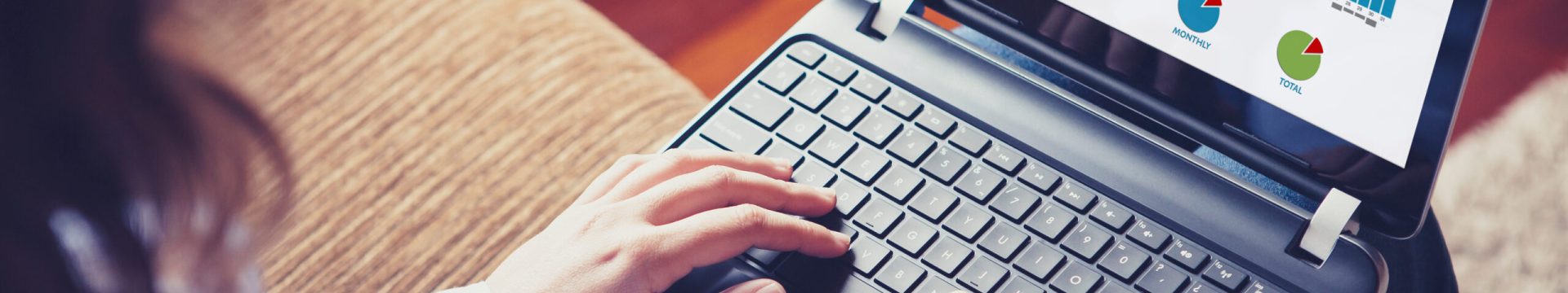 Web statistics consulting. Woman using a laptop computer to anal