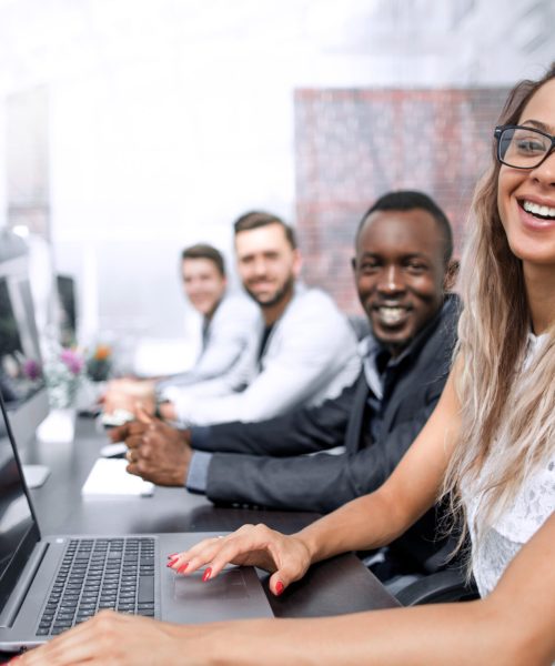 business woman and a group of employees in the computer room.people and technology